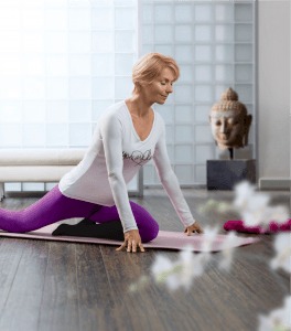 Woman doing yoga on the floor wearing compression socks