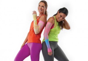 Two women wearing compression sleeves