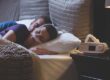 Woman wearing her CPAP nose mask and sleeping