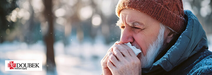 Doubek-CPAPSideEffects Man outside in the winter holding a tissue to his nose and over his mouth